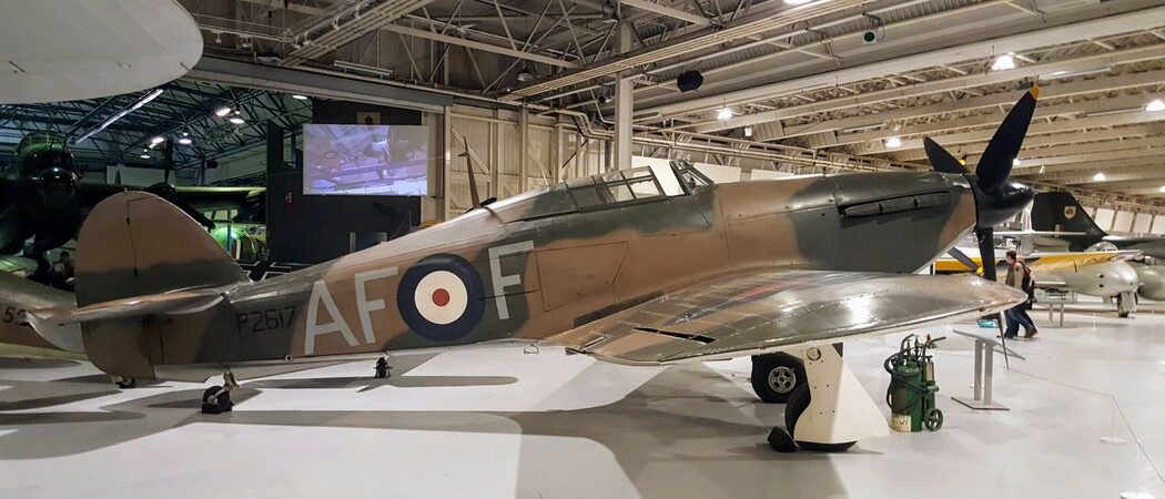 A brown & green camouflaged Hurricane fighter