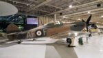 A brown & green camouflaged Hurricane fighter