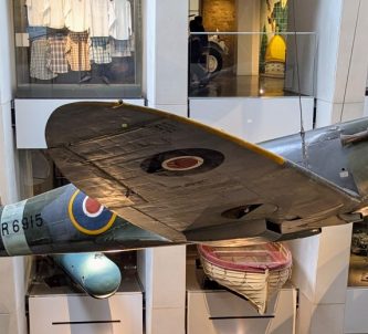 Spitfire suspended on wires in the Atrium of the IWM London