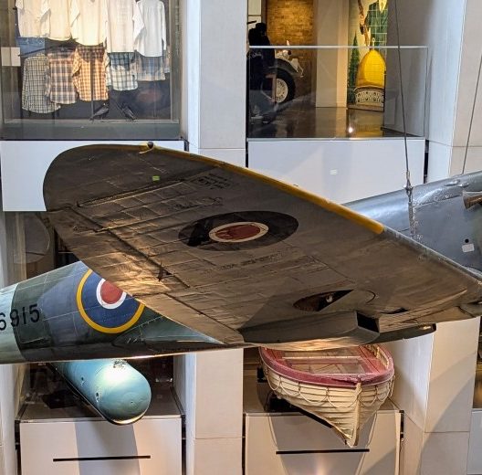 Spitfire suspended on wires in the Atrium of the IWM London
