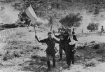 Italian soldiers waving a white flag