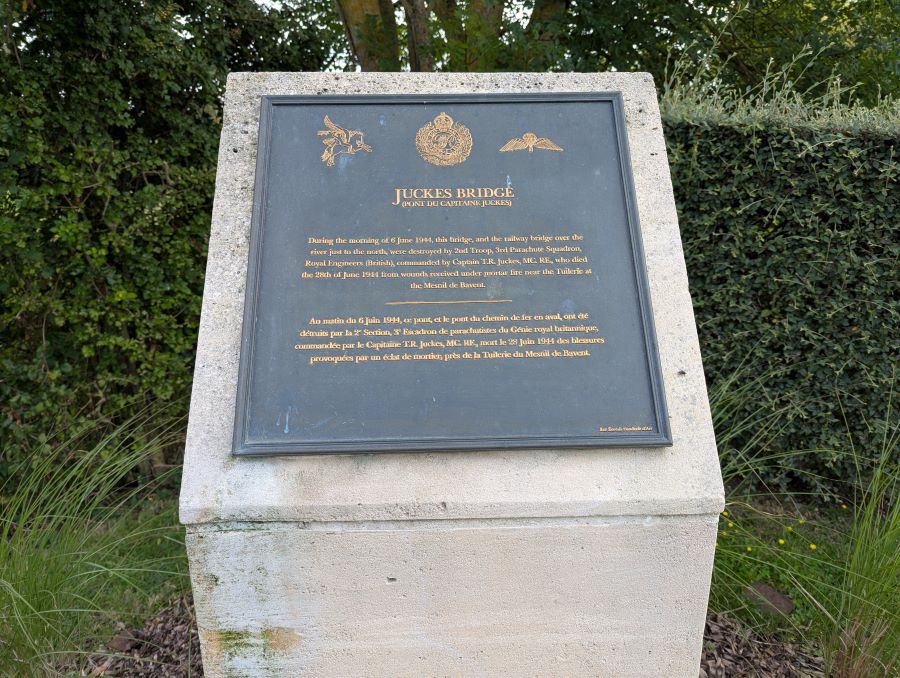 Close up of the plaque on the large stone plinth beside the bridge at Bures-sur-Dives, as testimony to its destruction by Capt Tim Juckes and his team of Royal Engineer sappers on D-Day