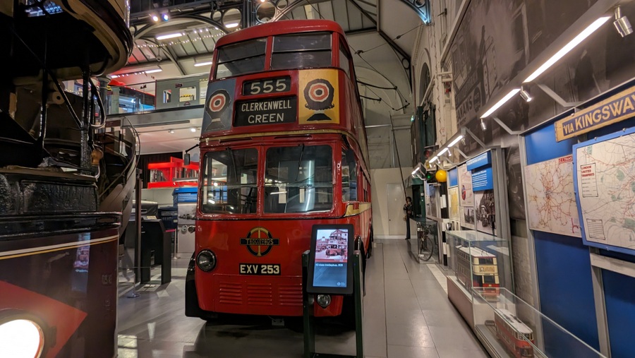 Traditional looking, Routemaster style red bus, only with a trolley pole to collect electric power from the overhead power lines