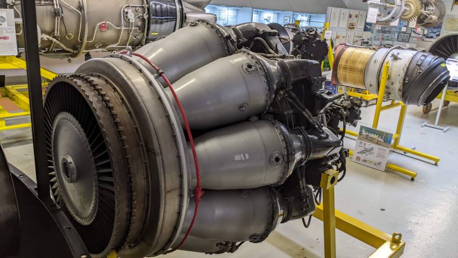 Small grey jet engine with rotary cylinders around the main chamber