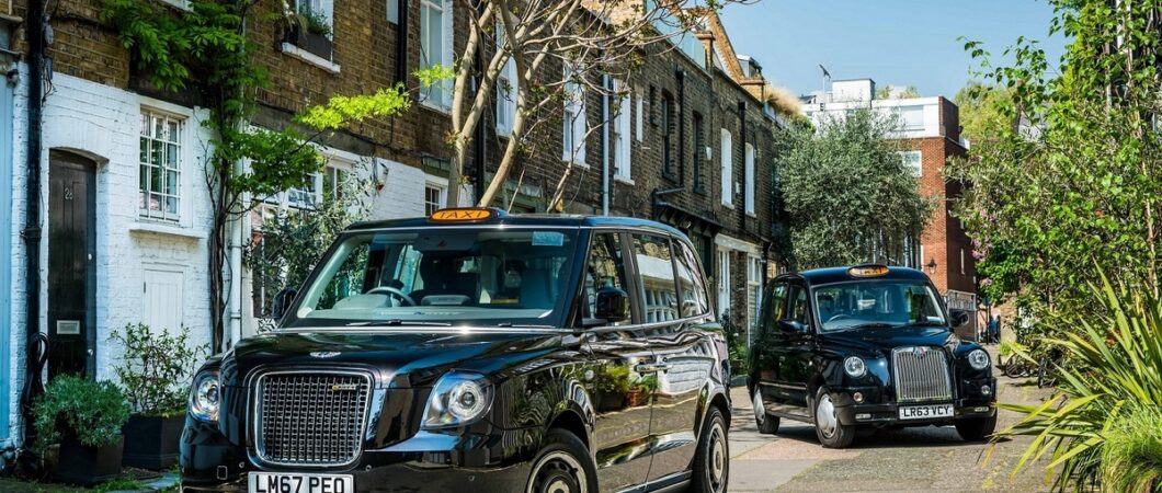 Two black cabs in a London mews