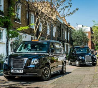 Two black cabs in a London mews