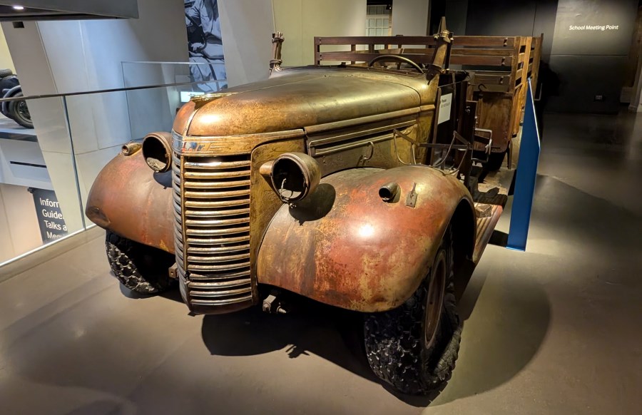 A weathered brown=bronze army truck