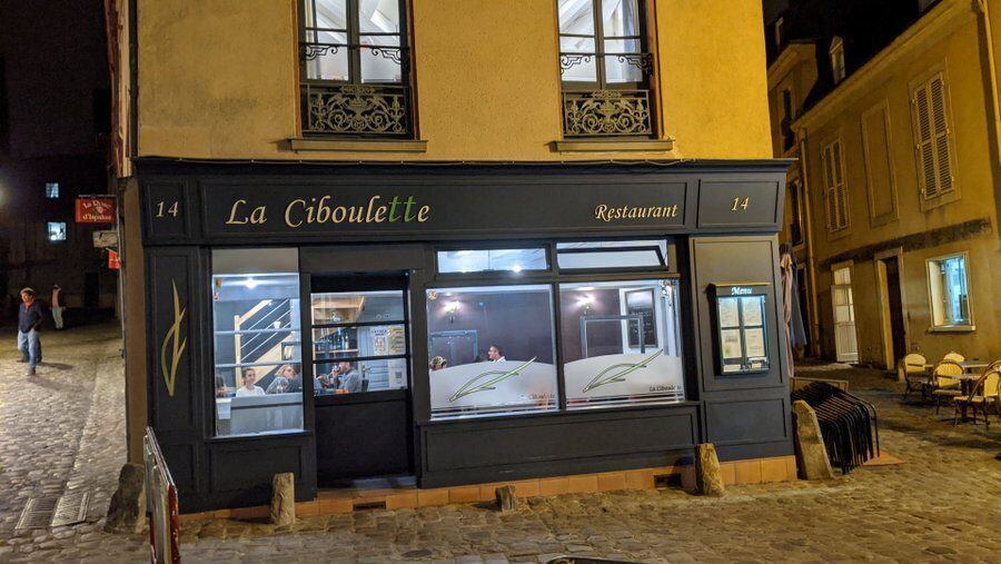 Small restaurant at night in the cobbled streets of Le Mans