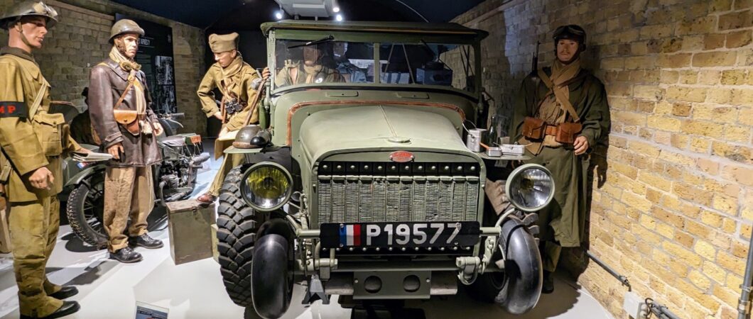 A group of Allied soldiers (mannequins) stand next to a Laffly v15T military truck