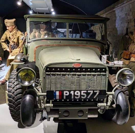 A group of Allied soldiers (mannequins) stand next to a Laffly v15T military truck