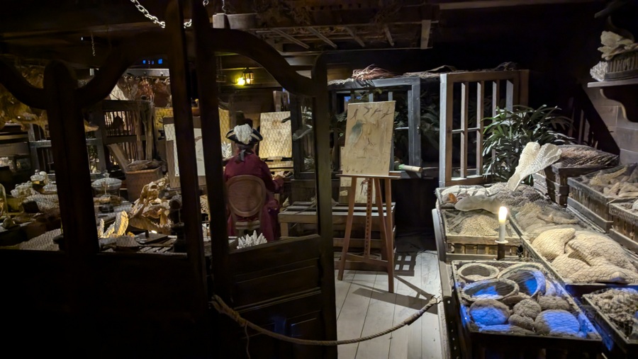 A cabin is strewn with instruments, papers and specimens