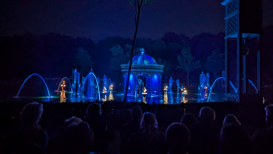 Colourful characters among blue lit scenery on the lake surface