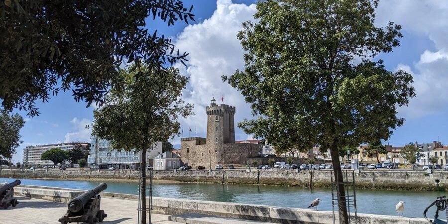 A view of a castle on the other side of a waterway