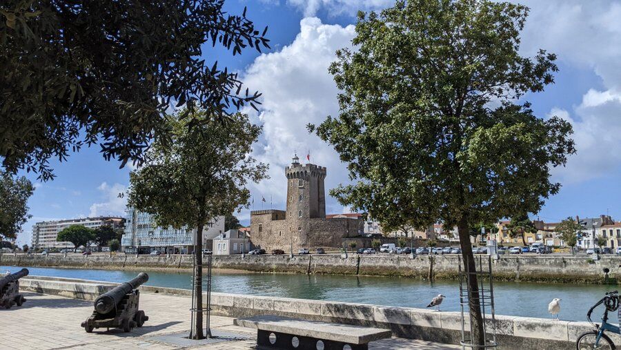 A view of a castle on the other side of a waterway