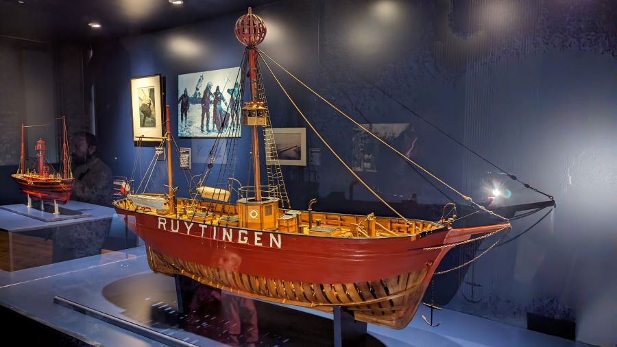 Model of an old fashioned lightship in a glass display case