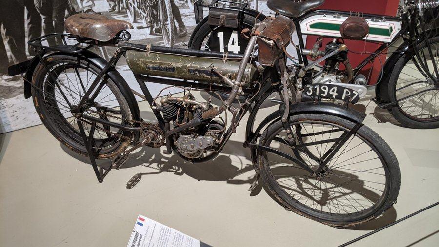 An old fashioned, slightly rusty Lion Peugeot motorbike at the 24hr Le Mans Museum