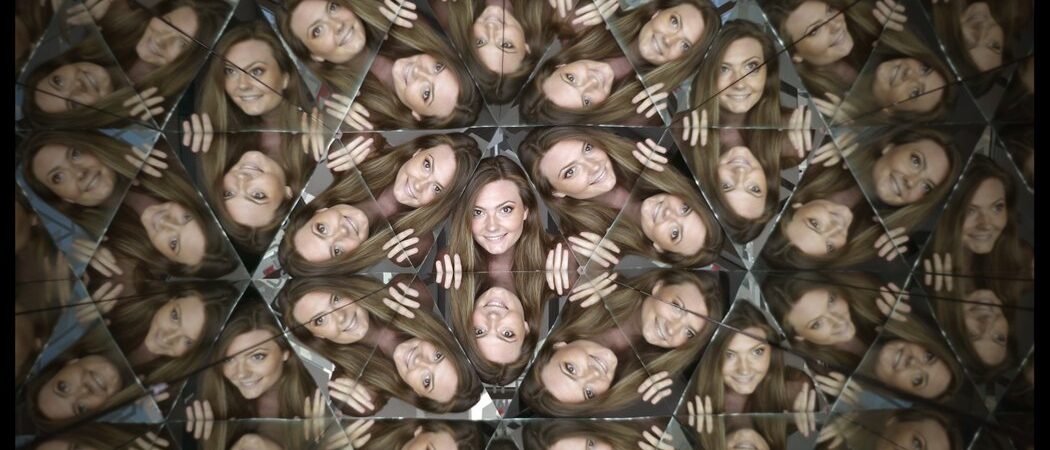 A girl's face is mirrored in hundreds of triangles