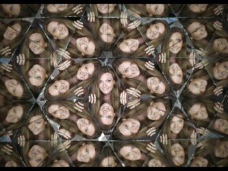 A girl's face is mirrored in hundreds of triangles