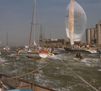 Tracey Edwards boat returning to Southhampton in 1973 and surrounded by a welcoming flotilla of small boats