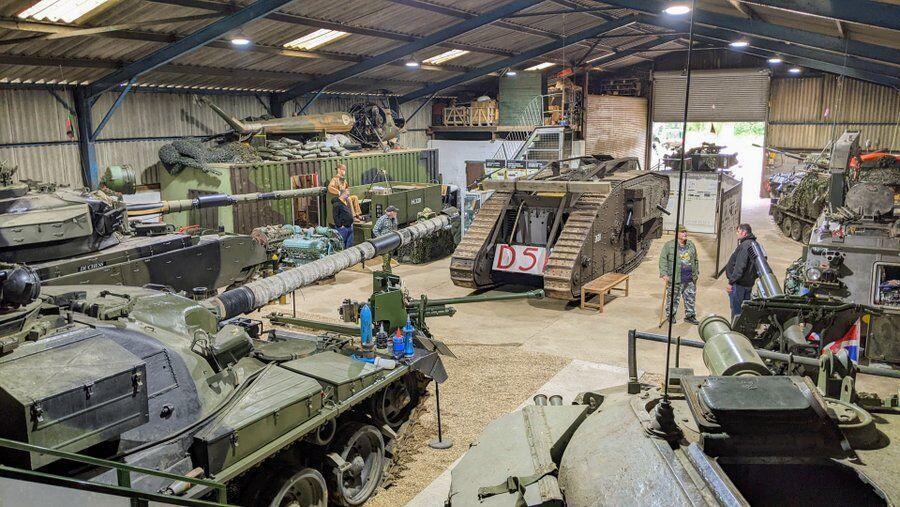 The inside of the main hanger at Norfolk Tank Museum, crowded with tanks