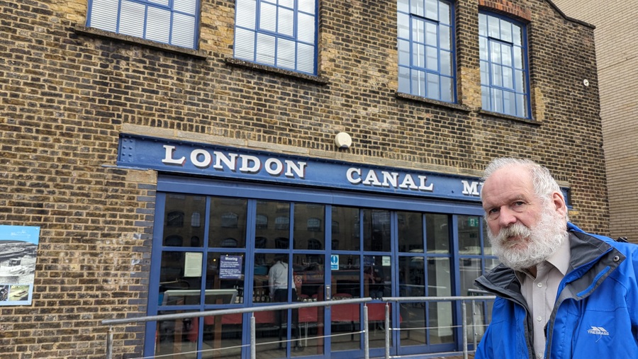 Martin Sachs leans into shot in front of the London Canal Museum