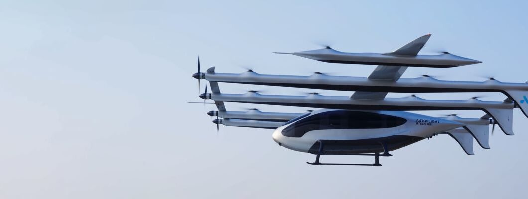 A futuristic white multi-rotor eVTOL flying