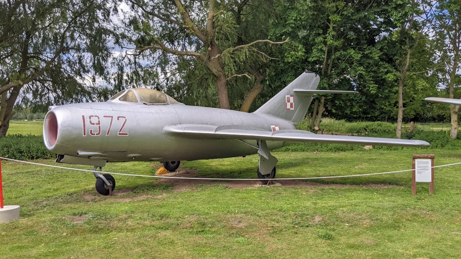 Small silver Cold War jet fighter