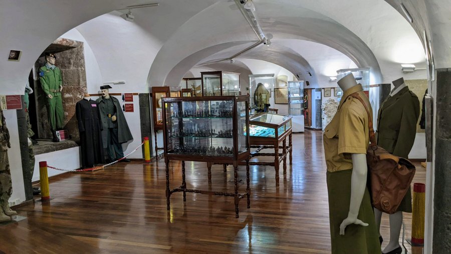 A gallery with uniforms displayed on mannequins
