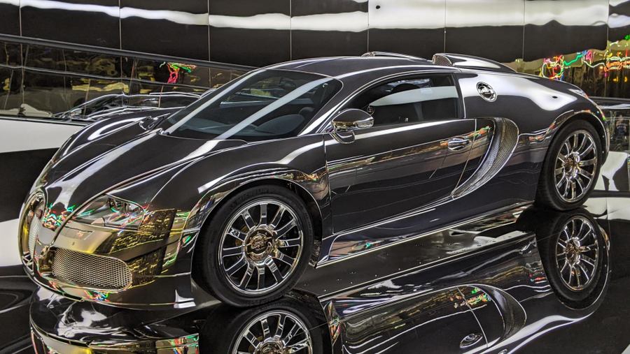 A Bugatti Veyron sports car with a mirror finish