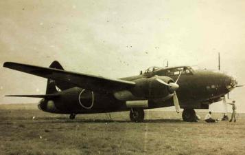 B/W photo of a Mitsubishi G4M bomber on an airfield