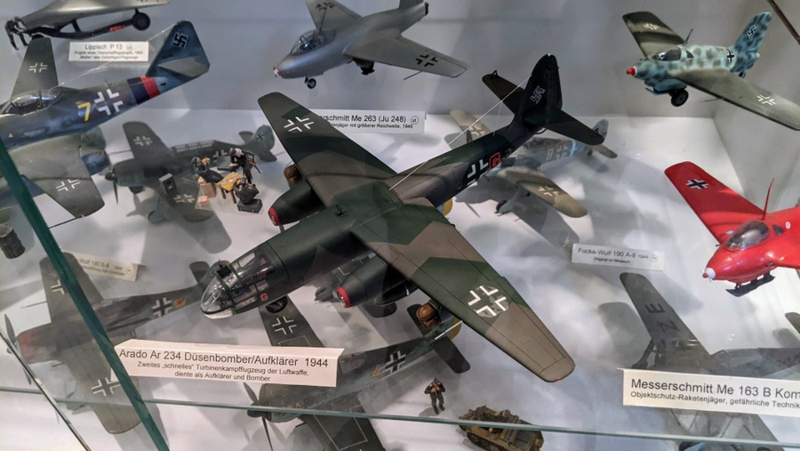 Model aircraft in a glass display case