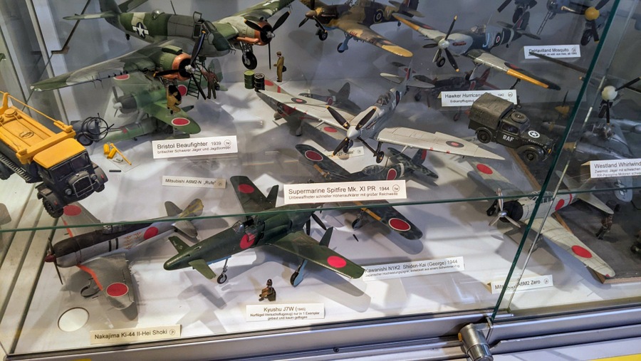 Model aircraft in a glass display case