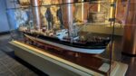 Large model of a 20th century cargo ship in a glass case