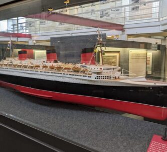 Large model of a classic transatlantic passenger liner in a glass case