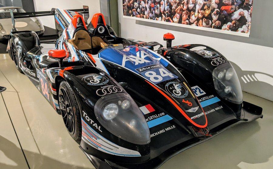 A low slung black-painted Morgan Onroak LMP2 at the 24hr Le Mans Museum