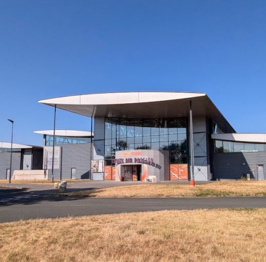 Exterior shot of the modern layered museum building