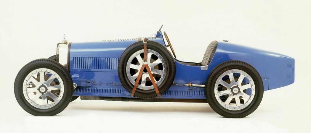 Classic blue open-top 2 seat sports car