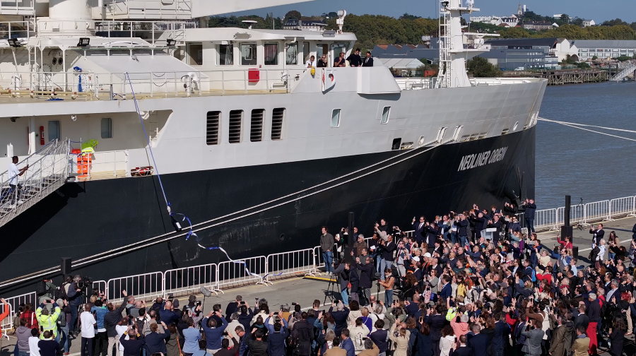 Crowds on the dockside with Neoliner Origin tied up alongside