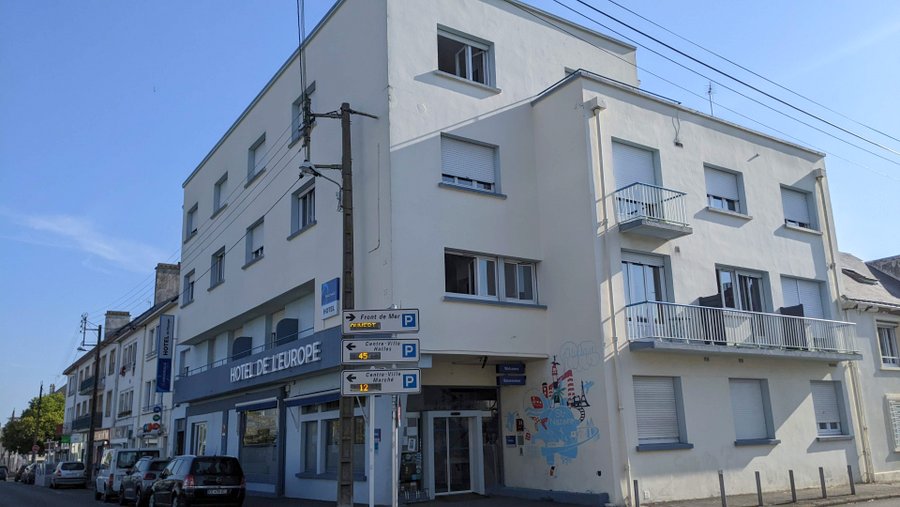 Four-storey white hotel building