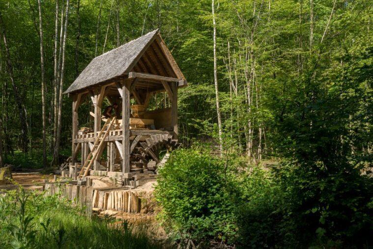 Medieval open sided watermill in the woods