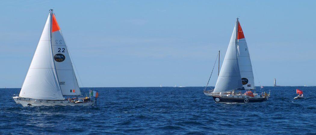 A pair of GGR sailing boats on a blue sea