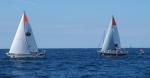 A pair of GGR sailing boats on a blue sea