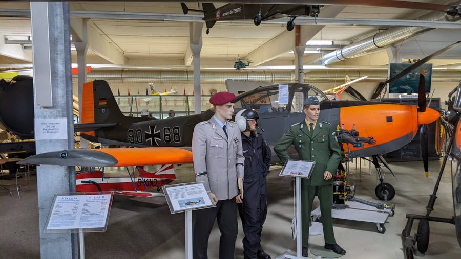 Italian & German officers stand around the Piaggio trainer