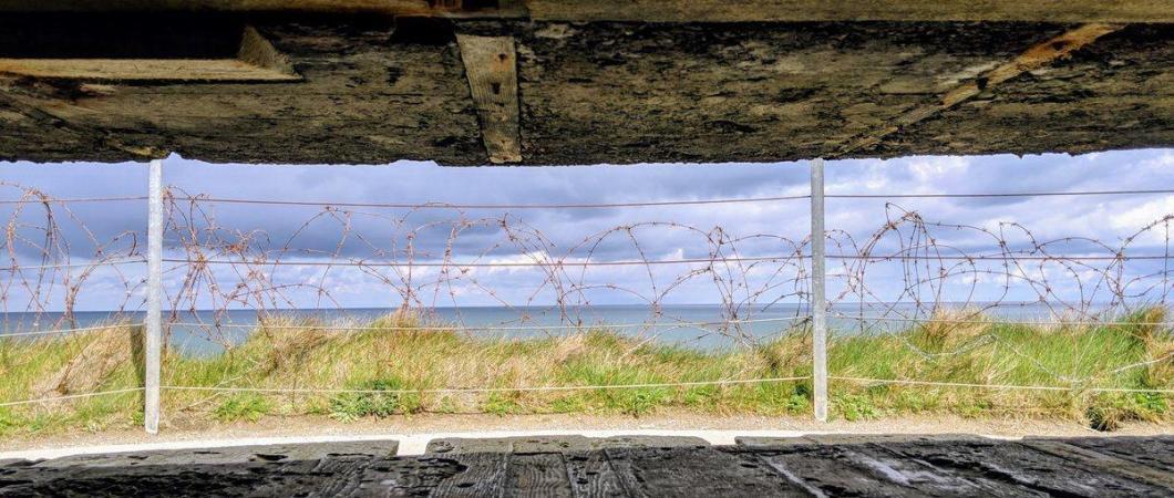 A view of the sea through a slit in the concrete observation bunker