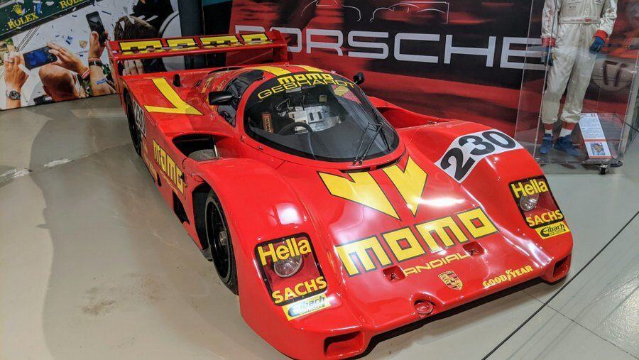 A red Porsche 962 at the 24hr Le Mans Museum