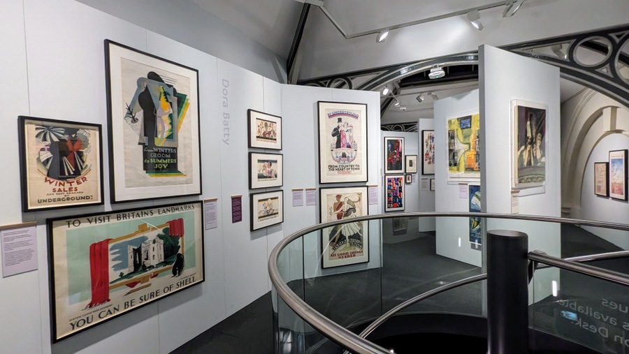 A gallery with numerous posters on the wall