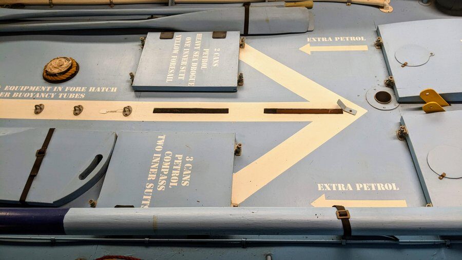 Compartments on the deck of the airborne lifeboat clearly marked with the contents inside