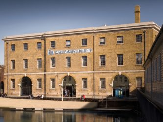 An image of the No. 6 Boathouse with a RM Experience sign added by AI