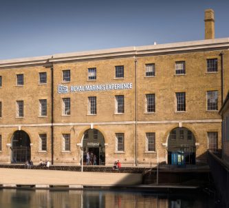 An image of the No. 6 Boathouse with a RM Experience sign added by AI