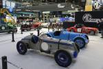 Two classic sportscars on a stand at the Rétromobile classic car show in Paris